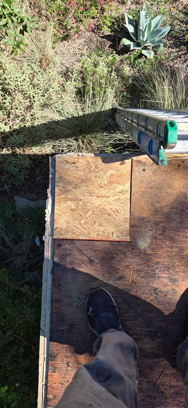 New roof deck panel installed flush where rotted decking was removed
